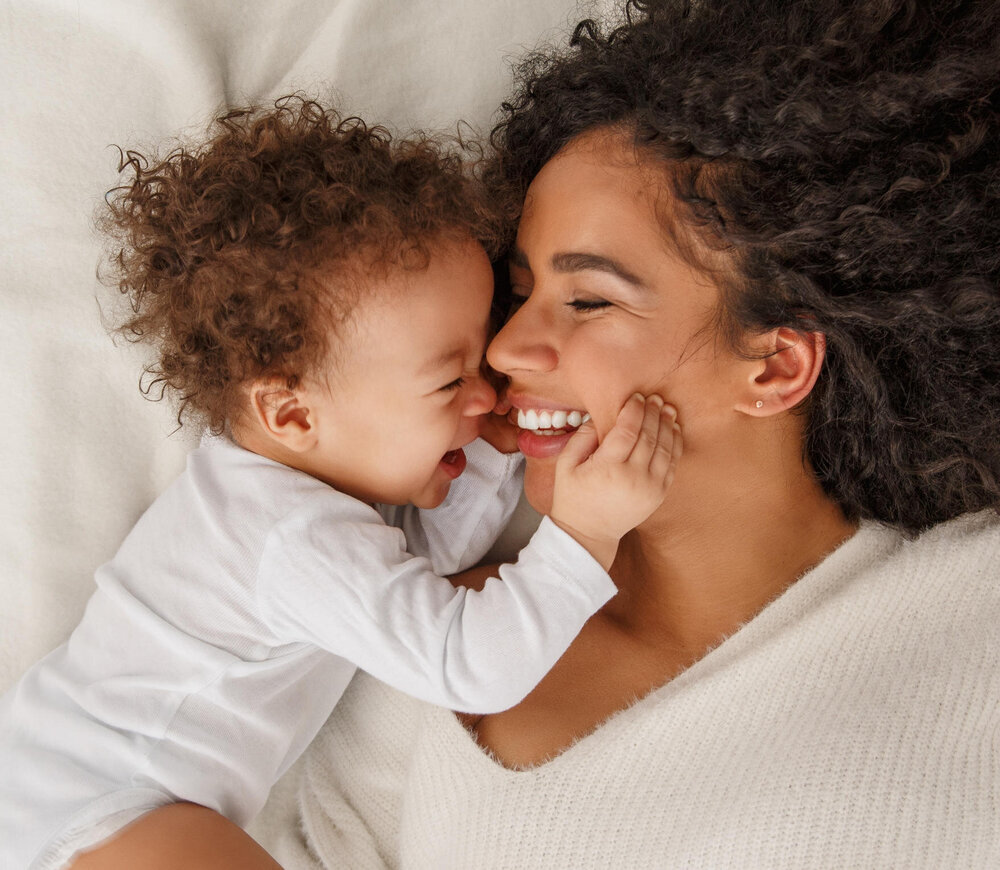 Laughing mother with her child