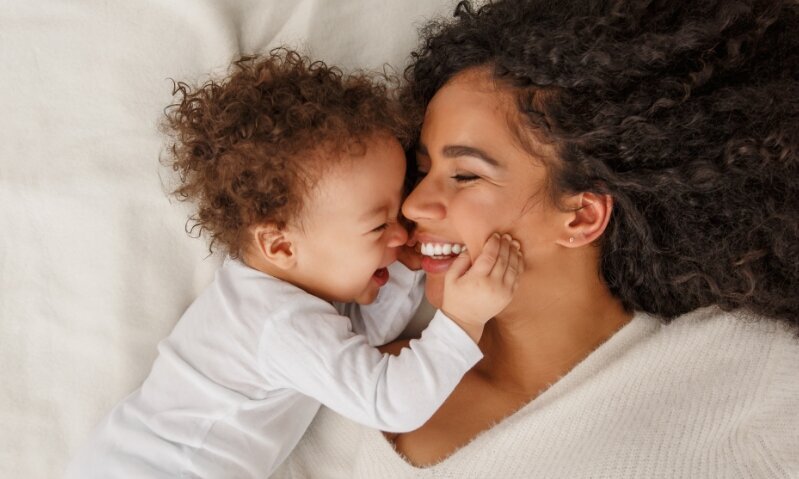 Laughing mother with her child